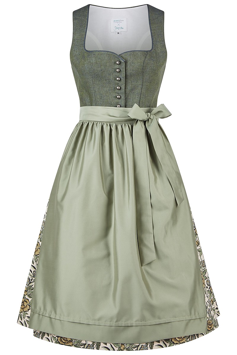 Grünes Dirndl mit meliertem Leinenmieder, vorne eine Reihe runder Metallknöpfe, mäßig tiefer Ausschnitt, weiter Rock mit floralem Muster am Saum sichtbar, darüber eine glatte Schürze in Salbeigrün mit seitlich gebundener Schleife, freigestellt vor weißem Hintergrund.