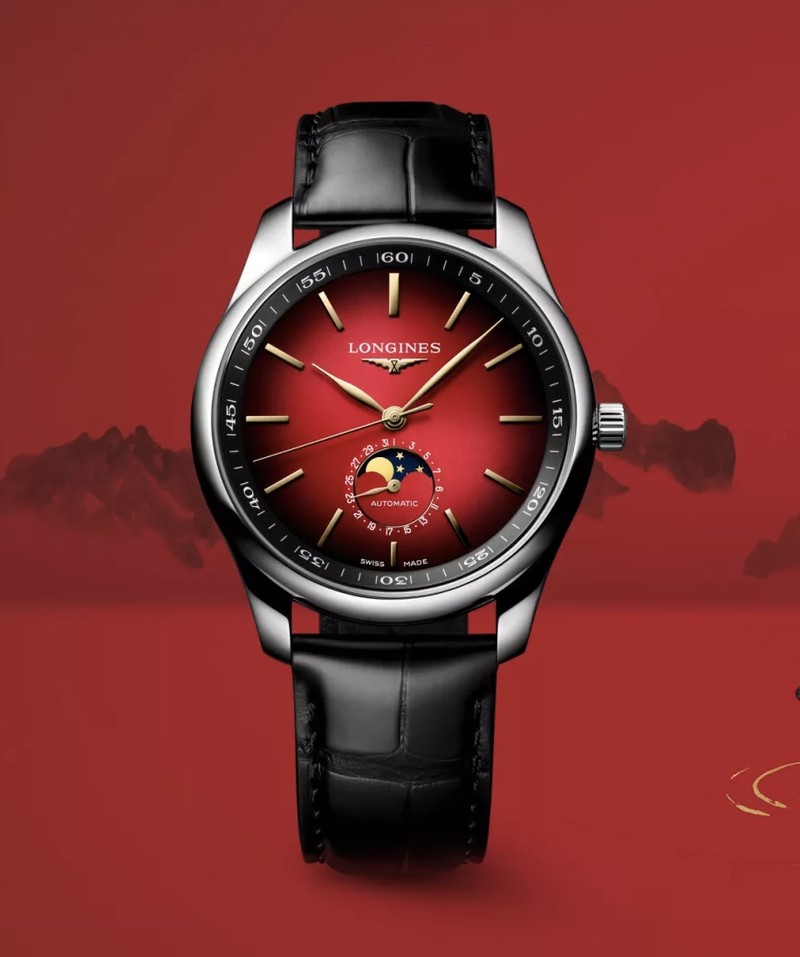 Armbanduhr mit Edelstahlgehäuse, rotem Zifferblatt mit Farbverlauf, vergoldeten Indizes, Mondphasenanzeige bei sechs Uhr und schwarzem Lederarmband